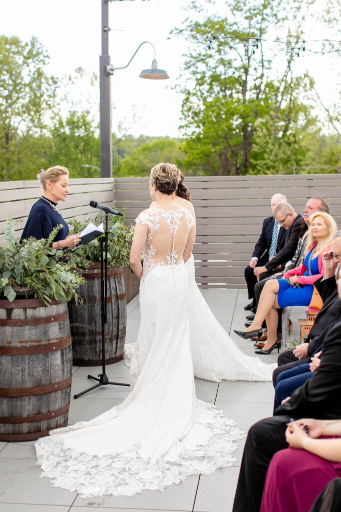 A couple standing up at their wedding saying their vows 
