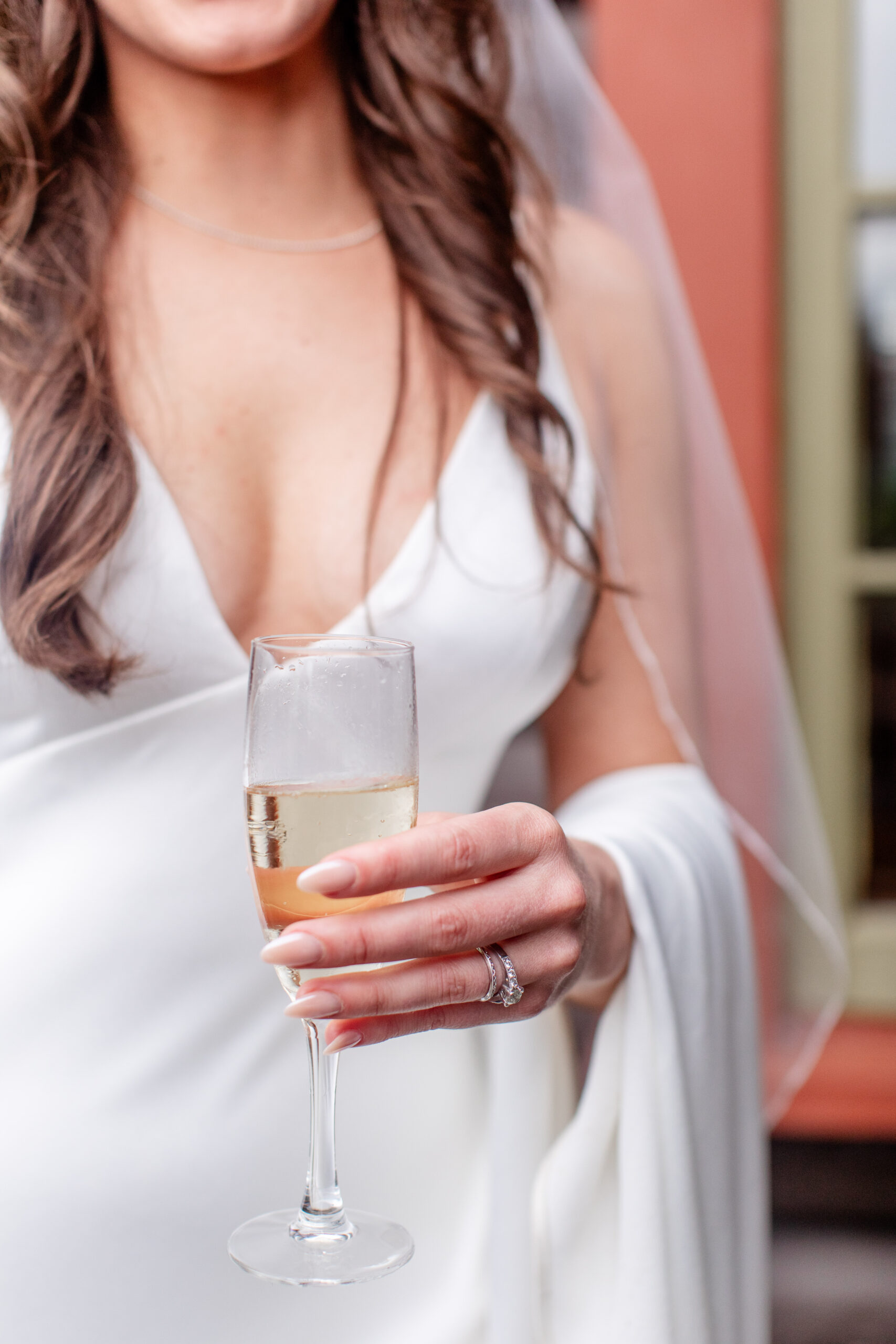 bride holding a champange glass