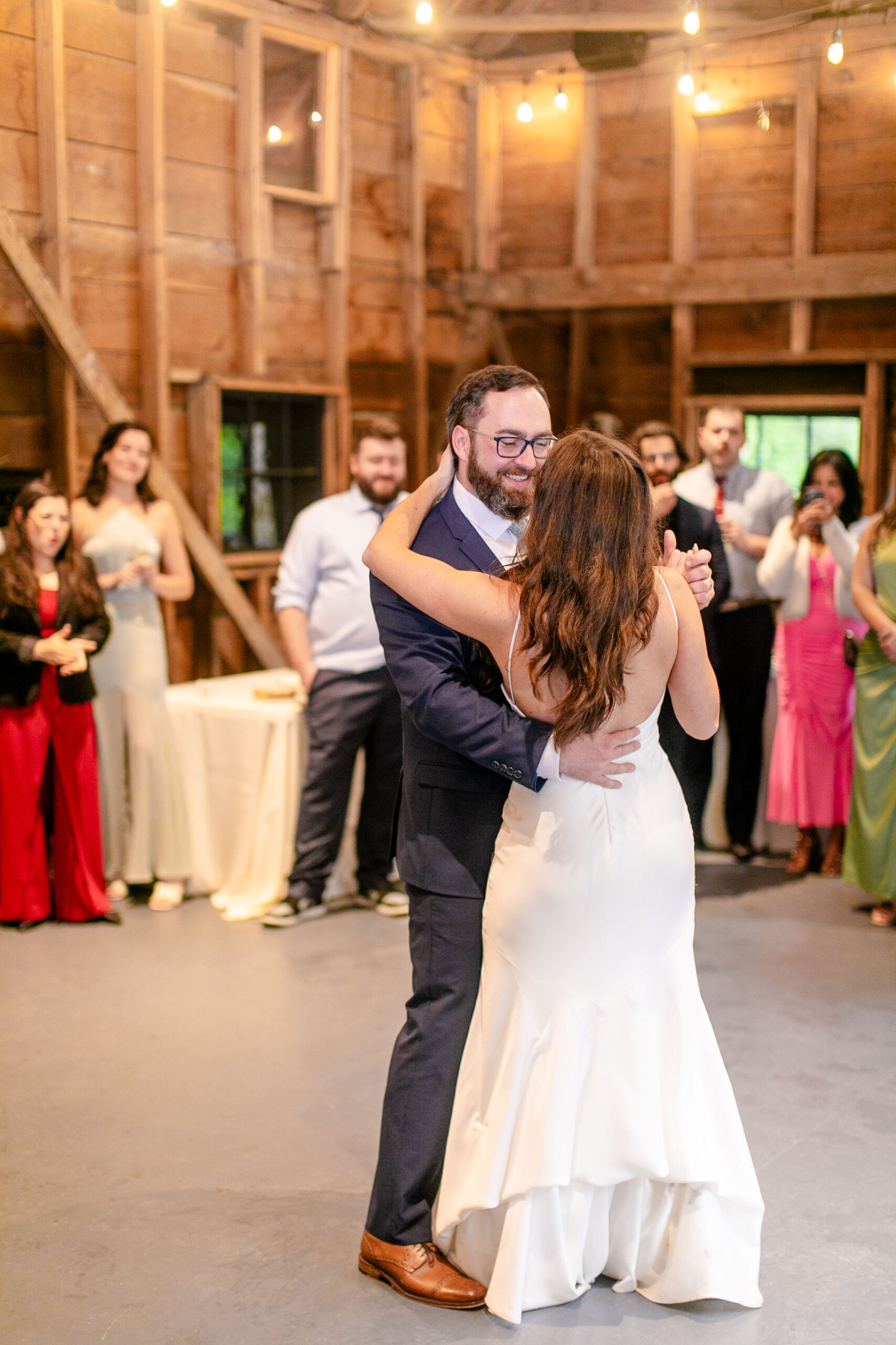 bride and groom dancing together 