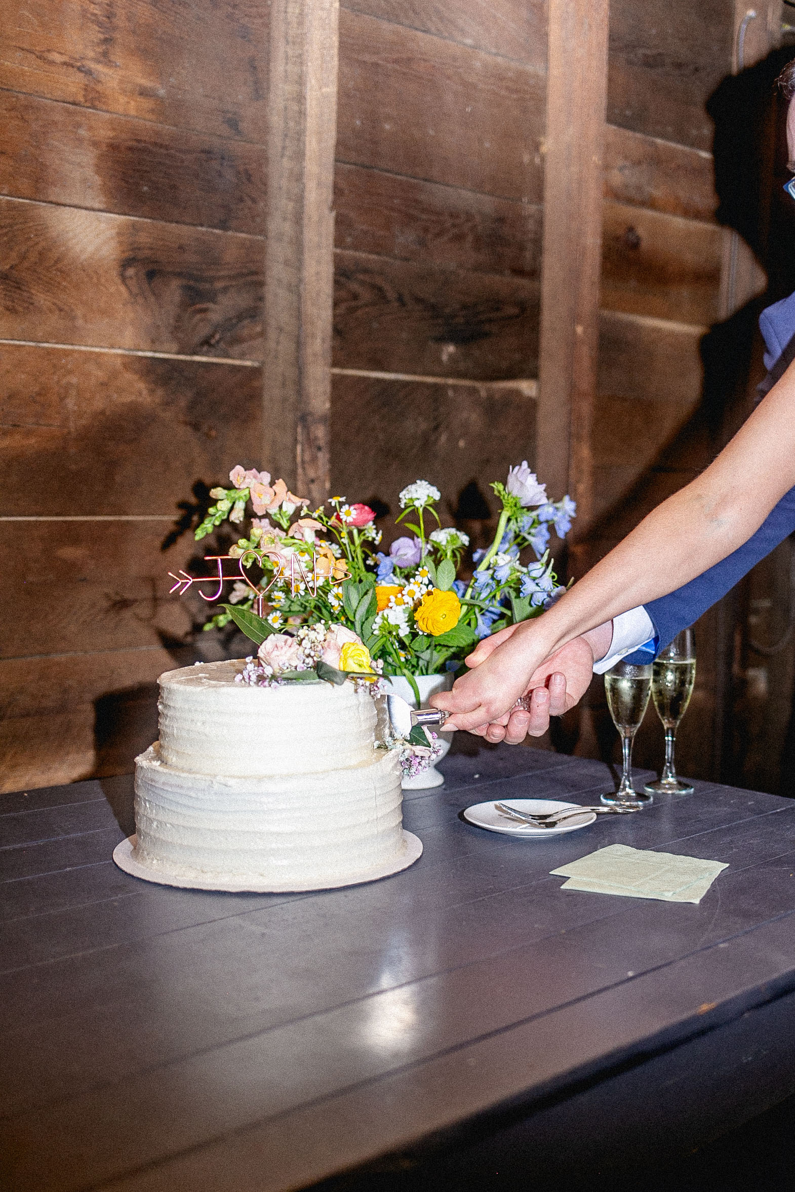 bride and groom cutting their cake