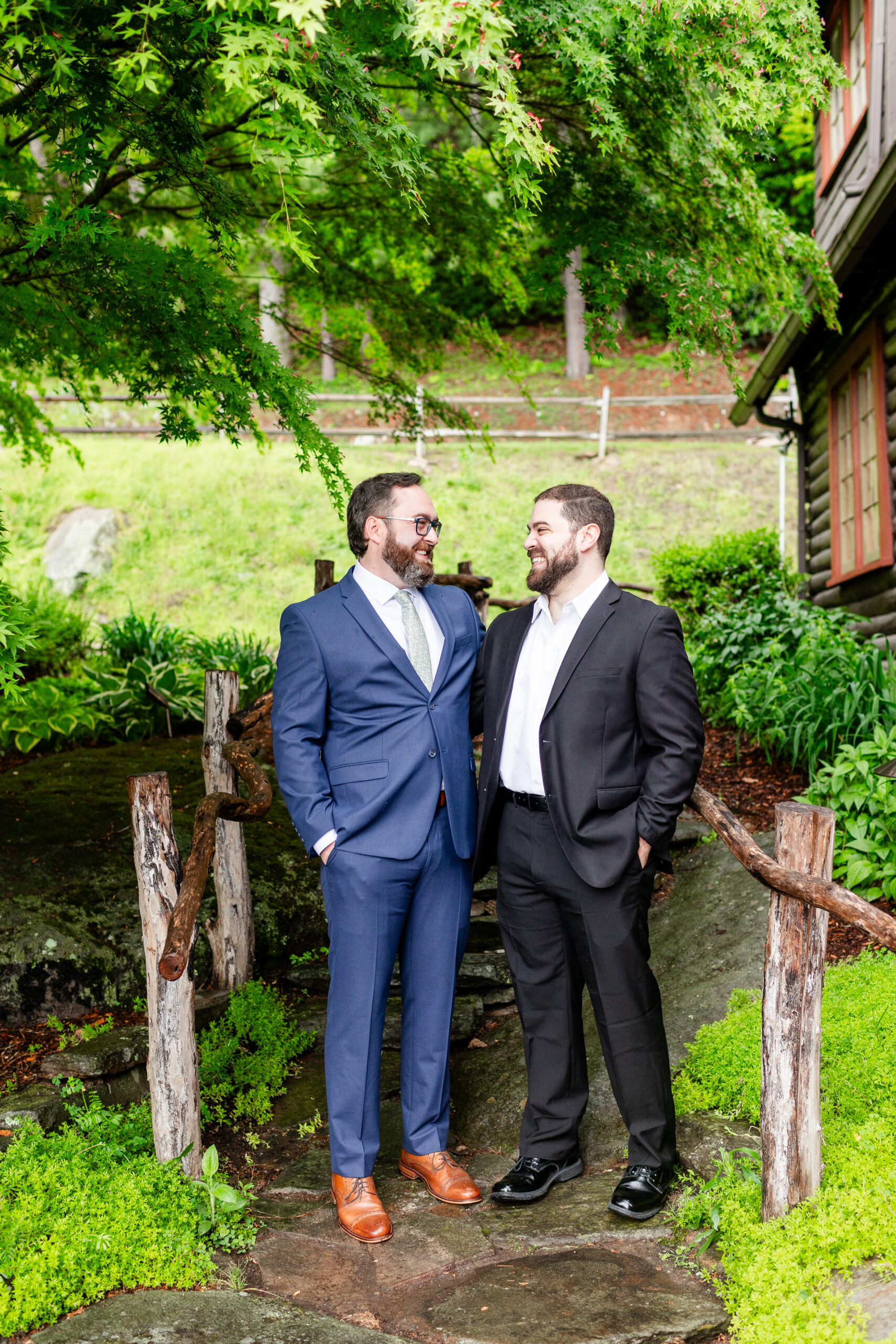 groom and groomsmen laughing with eachother 