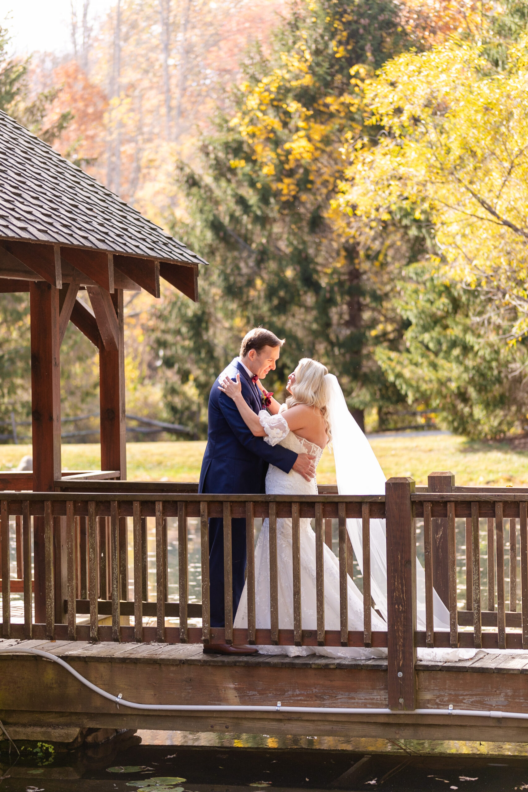 bride and groom looking at each other for the first time on their wedding day holding each other