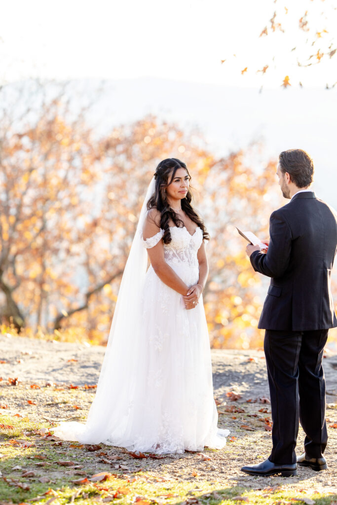 Bride during a Craggy Gardens elopement in the Blue Ridge Mountains as vows are read in Asheville North Carolina