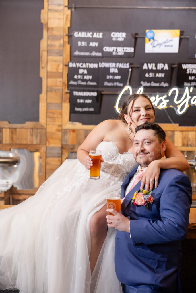 Bride and Groom at Highland Brewing Company for wedding in Asheville, North Carolina enjoying local craft beer 