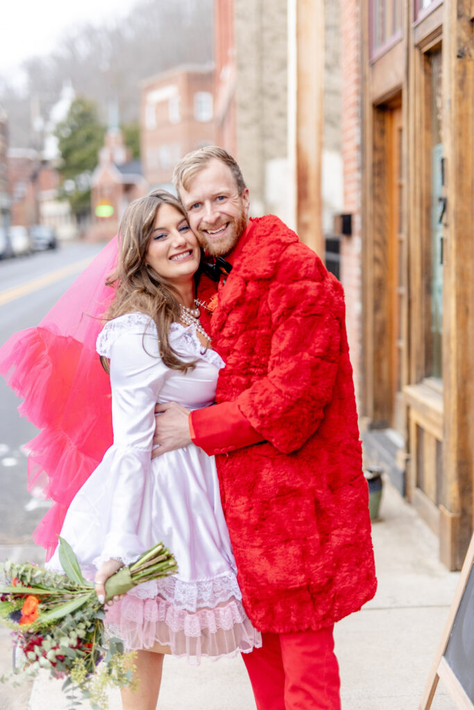  bride and groom celebrating at a fun and colorful downtown Asheville NC wedding venue
