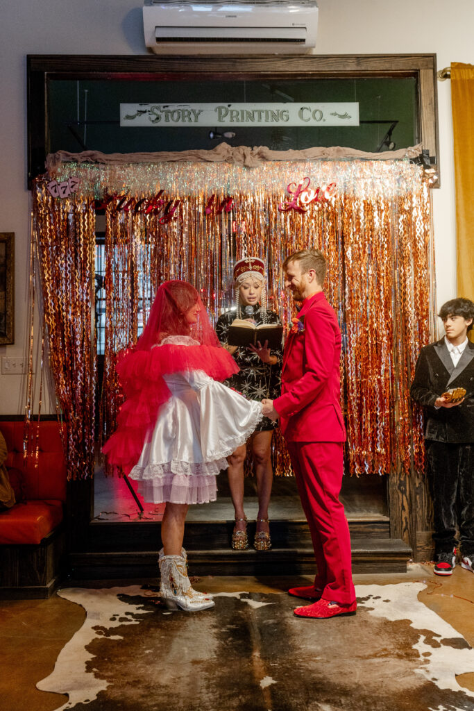  bride and groom celebrating at a fun and colorful downtown Asheville NC wedding venue
